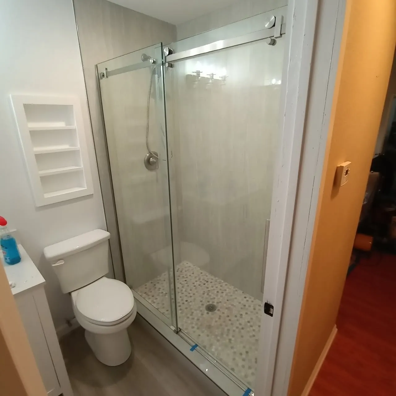 Frameless glass shower built by Concord Roofing & Construction