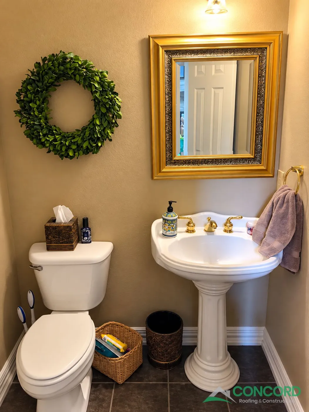 Powder bathroom in Frisco, TX before the remodel, with a pedestal sink, a gold-framed mirror, and a toilet