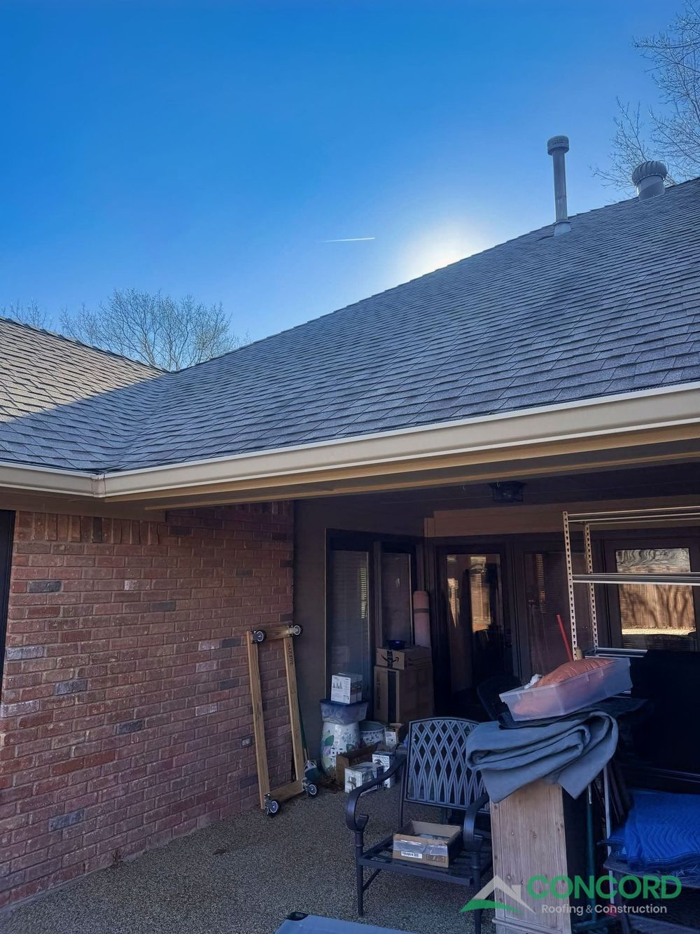 Covered patio under the main roof of a Garland, TX home before it was enclosed