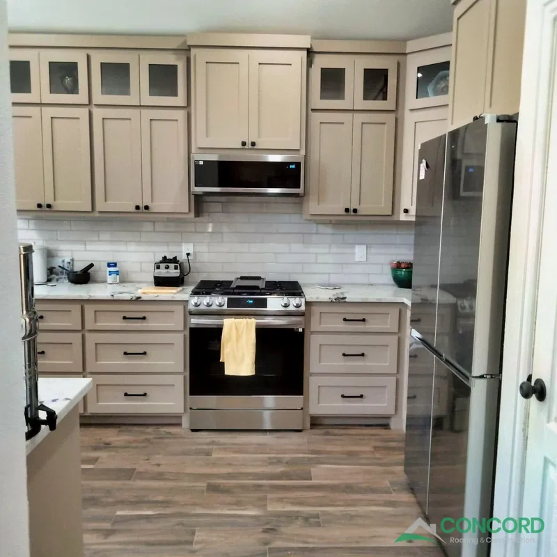 Finished kitchen remodel with painted cabinets and a new range in McKinney, TX