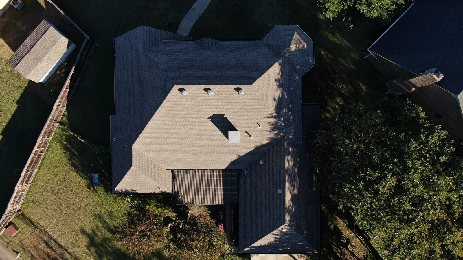 Aerial drone view of a completed residential roof replacement by Concord Roofing & Construction