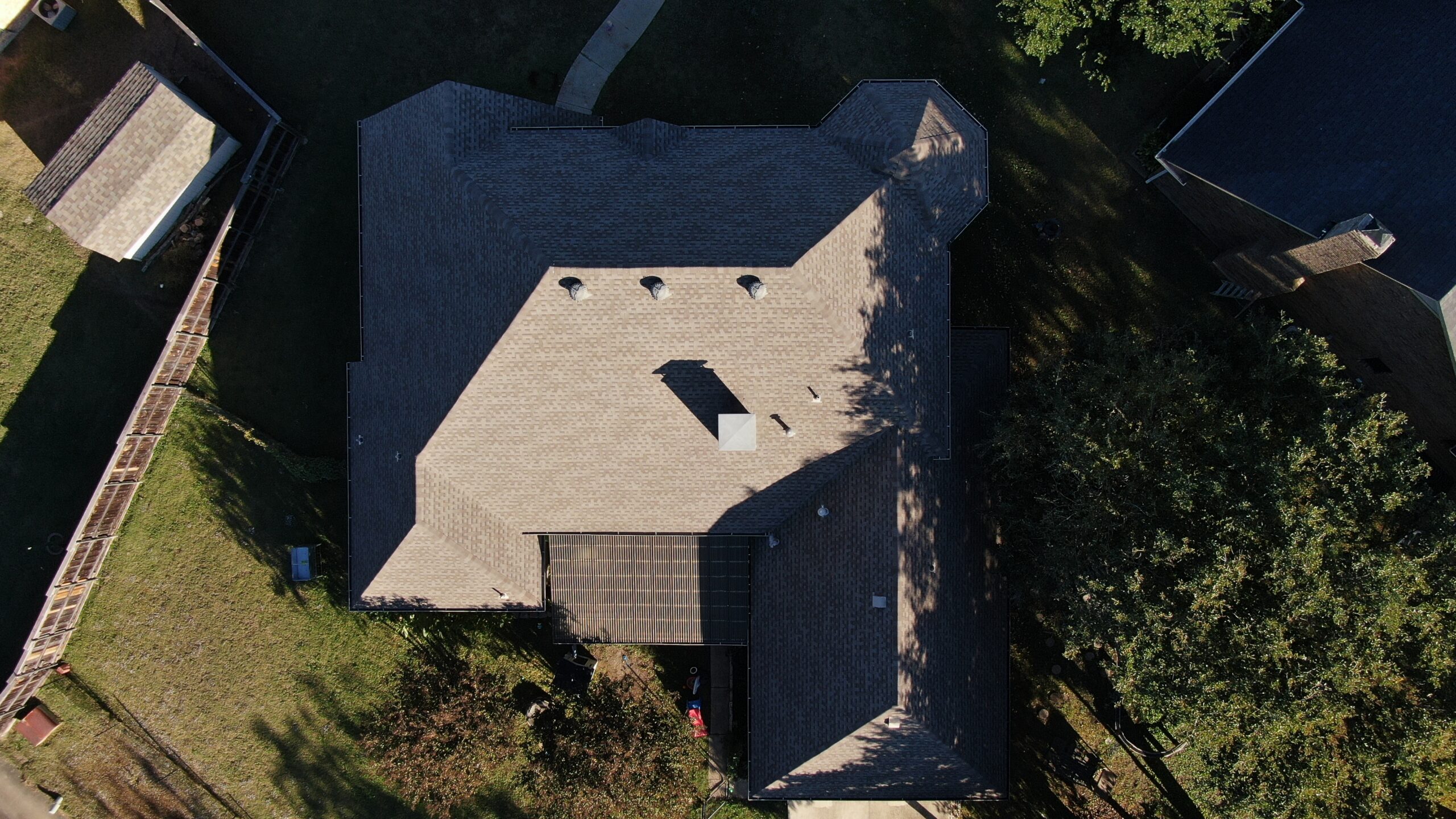 Aerial drone view of a completed roof replacement by Concord Roofing & Construction