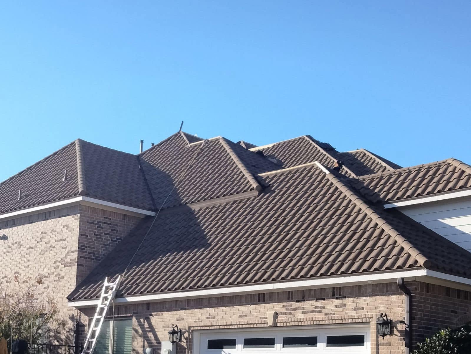 Stone-coated steel roof installation in progress by Concord Roofing & Construction